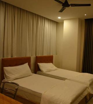 Triple Sharing Room setup at Hotel Hibiscus Tree